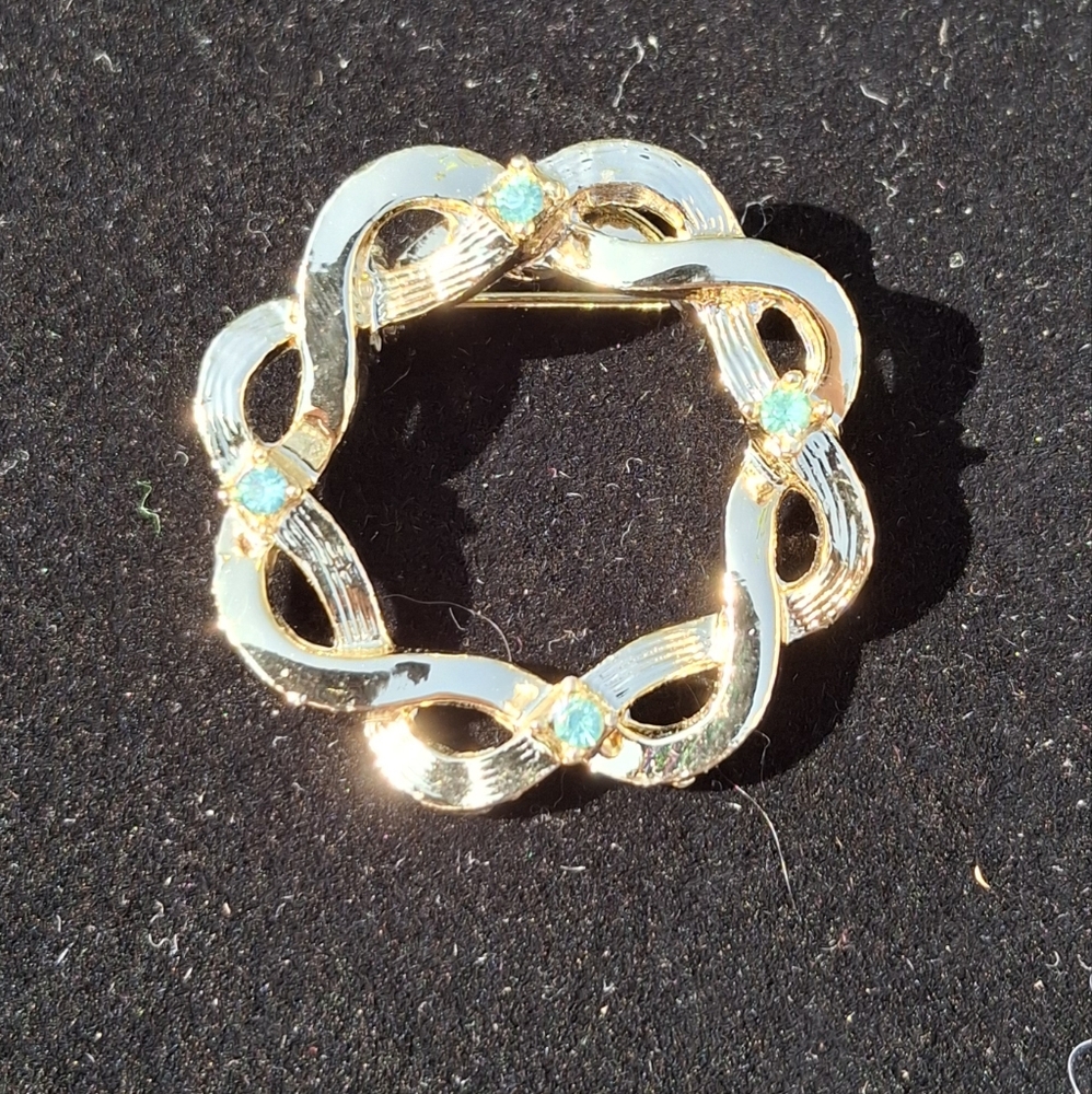 Circular Gold and Light Blue Stone Brooch